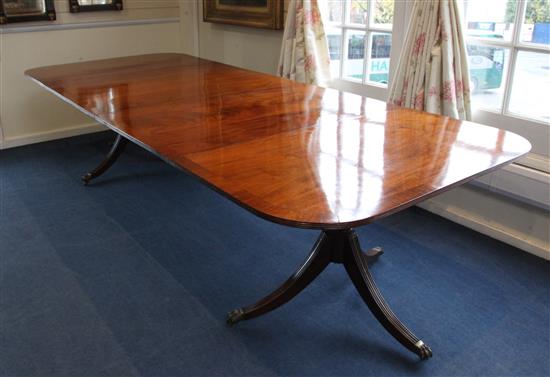 A Regency style mahogany twin pedestal extending dining table, Extended W.10ft D.4ft 1in. H.2ft 4in.